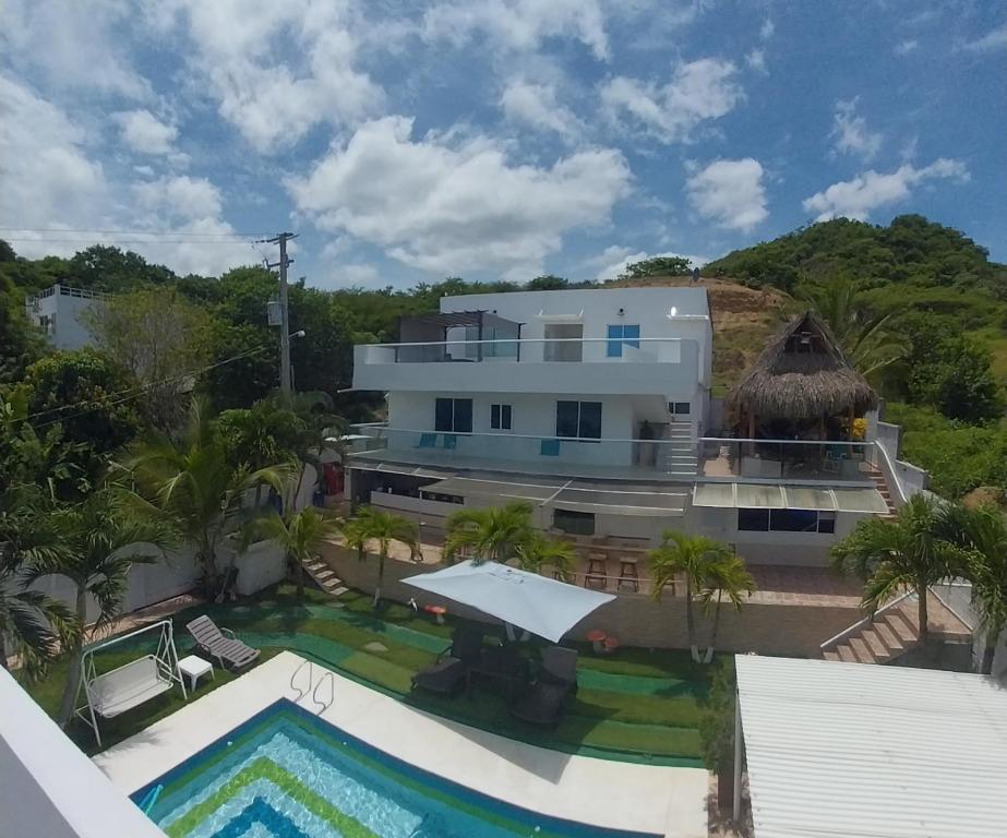 an aerial view of a house with a swimming pool at Cabaña villa kary in Barranquilla