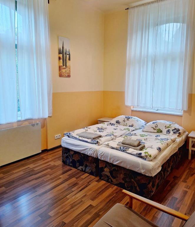 Postel nebo postele na pokoji v ubytování Apartmán Nad hradem