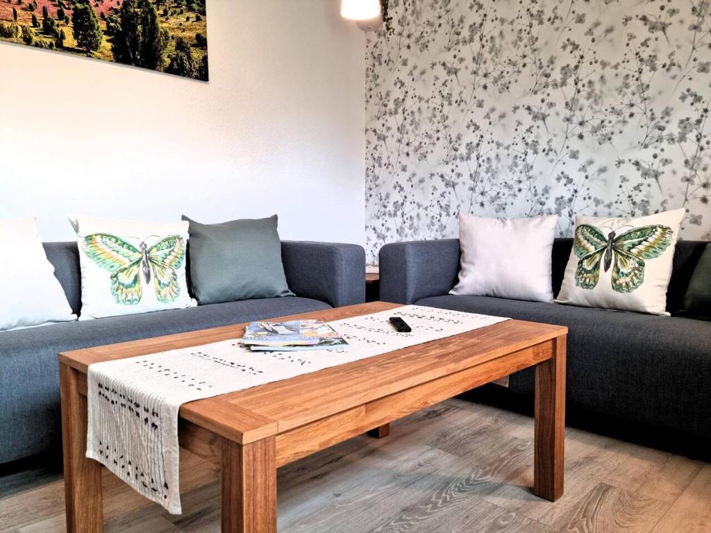 a living room with a couch and a coffee table at Ferienwohnung Wipperau II in Uelzen