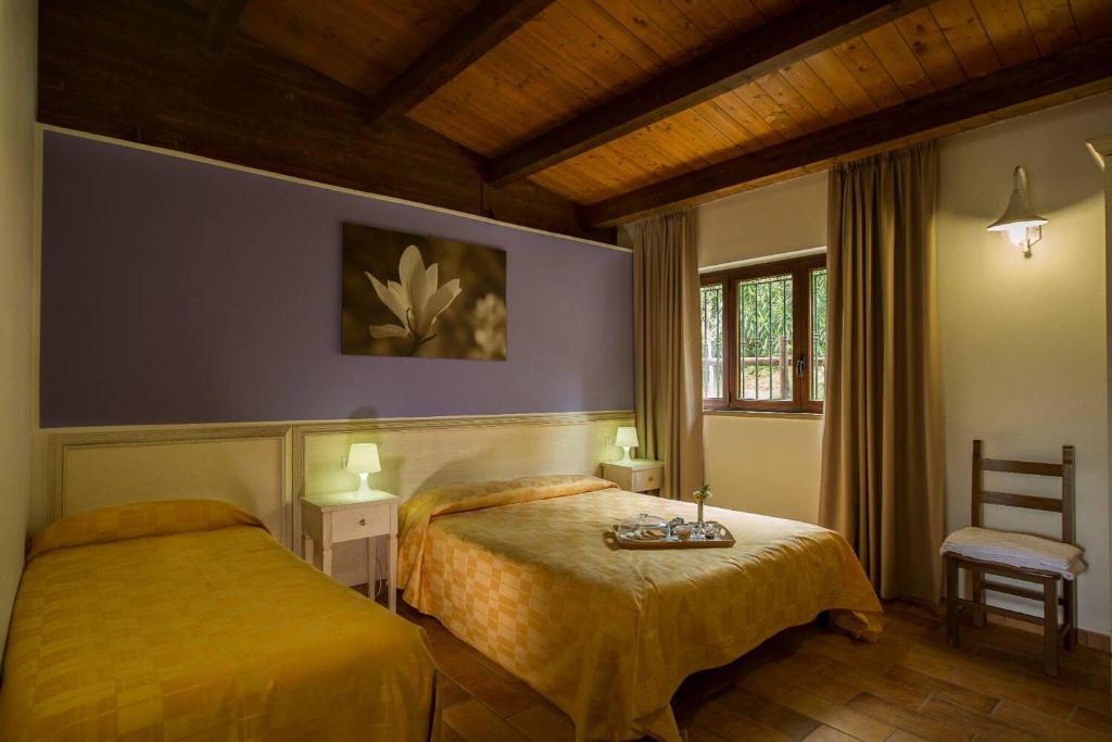Postel nebo postele na pokoji v ubytování Country House Il Cascinale