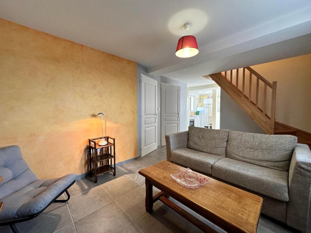 a living room with a couch and a table at So Sweet in Bligny-lès-Beaune
