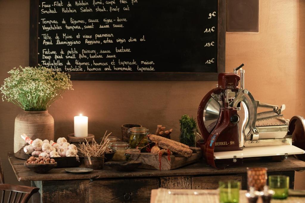 a table with a sewing machine and a chalkboard at Zannier Hotels Le Chalet in Megève