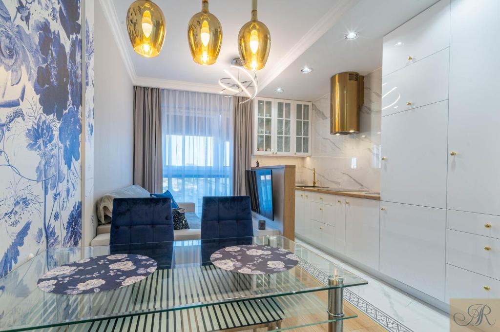 Η κουζίνα ή μικρή κουζίνα στο Apartament Rosa Stacja Mińsk