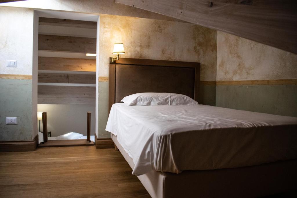 Postel nebo postele na pokoji v ubytování RESIDENZA BALIOS