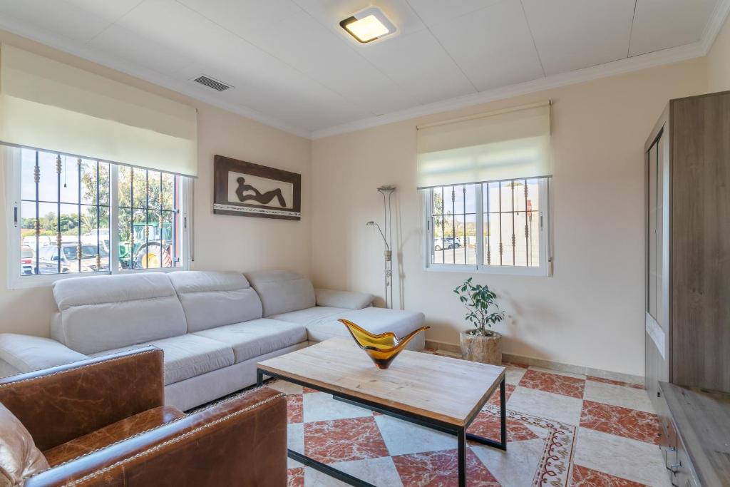 a living room with a couch and a table at Mar de Ilusiones in Caserío Bacarot