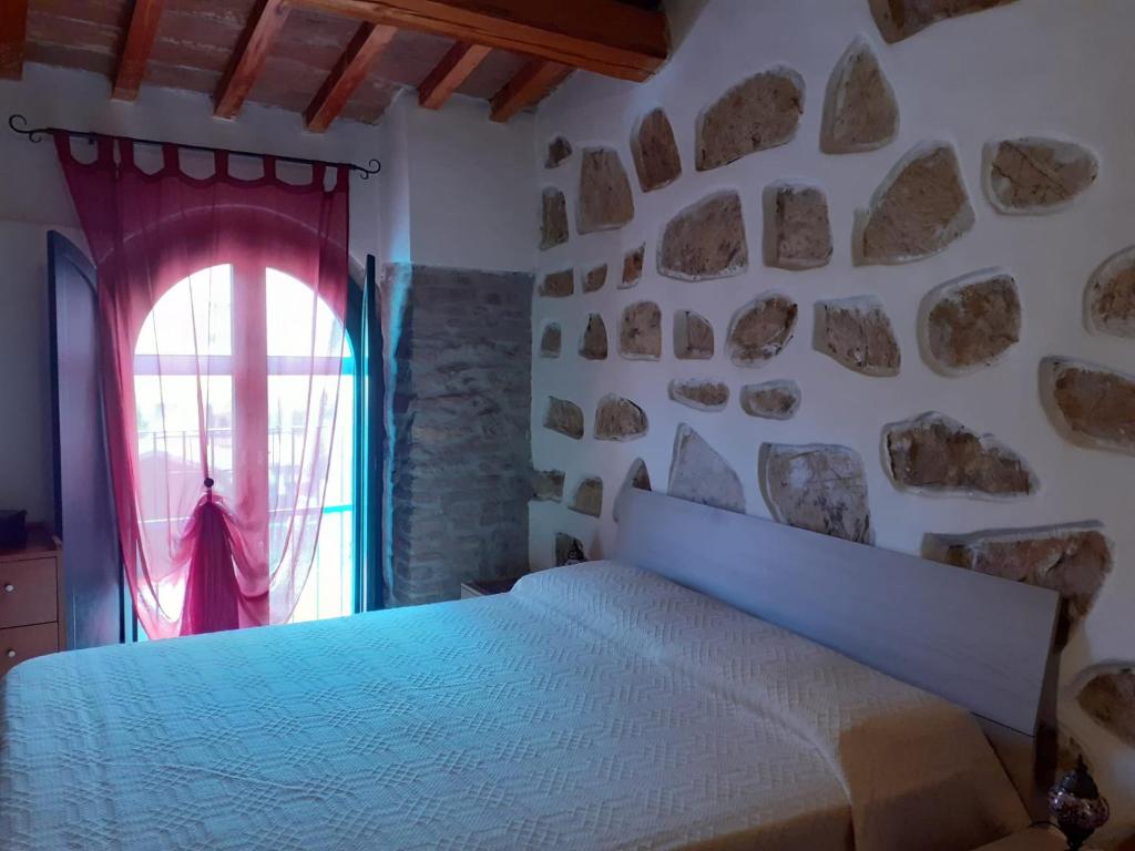 Voodi või voodid majutusasutuse Casa di nonno Gio toas