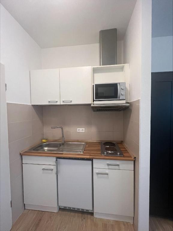 Kuchyň nebo kuchyňský kout v ubytování CASILINO Hotel A 20 Wismar