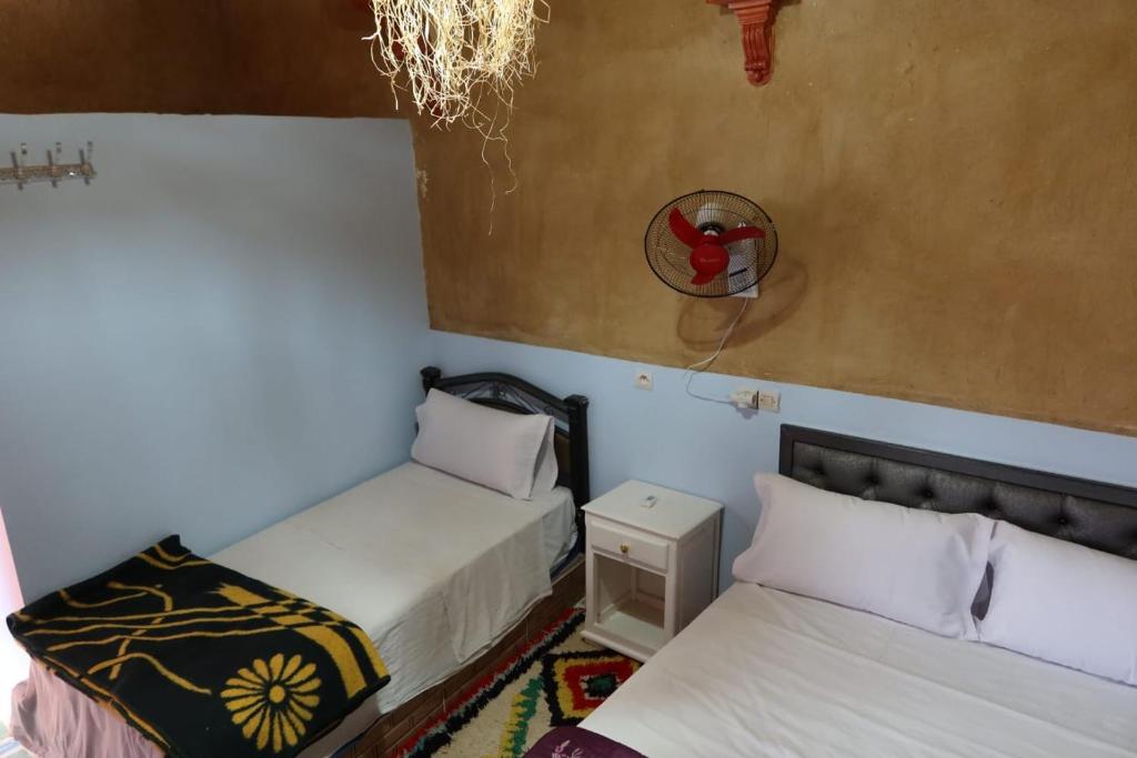 Postel nebo postele na pokoji v ubytování gîte d'étape ziz oasis