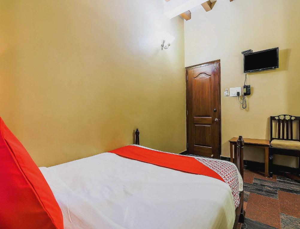 Postel nebo postele na pokoji v ubytování Hotel O Kams Coco De Parra