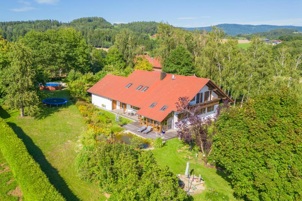 an overhead view of a house with a red roof at Ferienwohnung Bayerwaldblick Hexental in Bogen