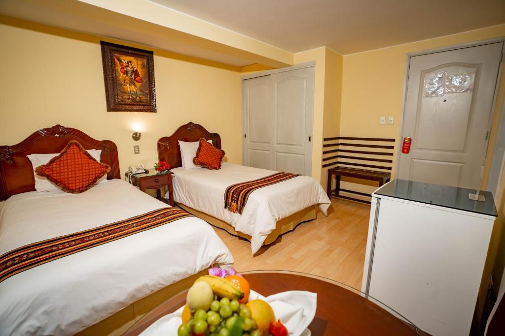 Rúm í herbergi á Hotel Agustos Cusco