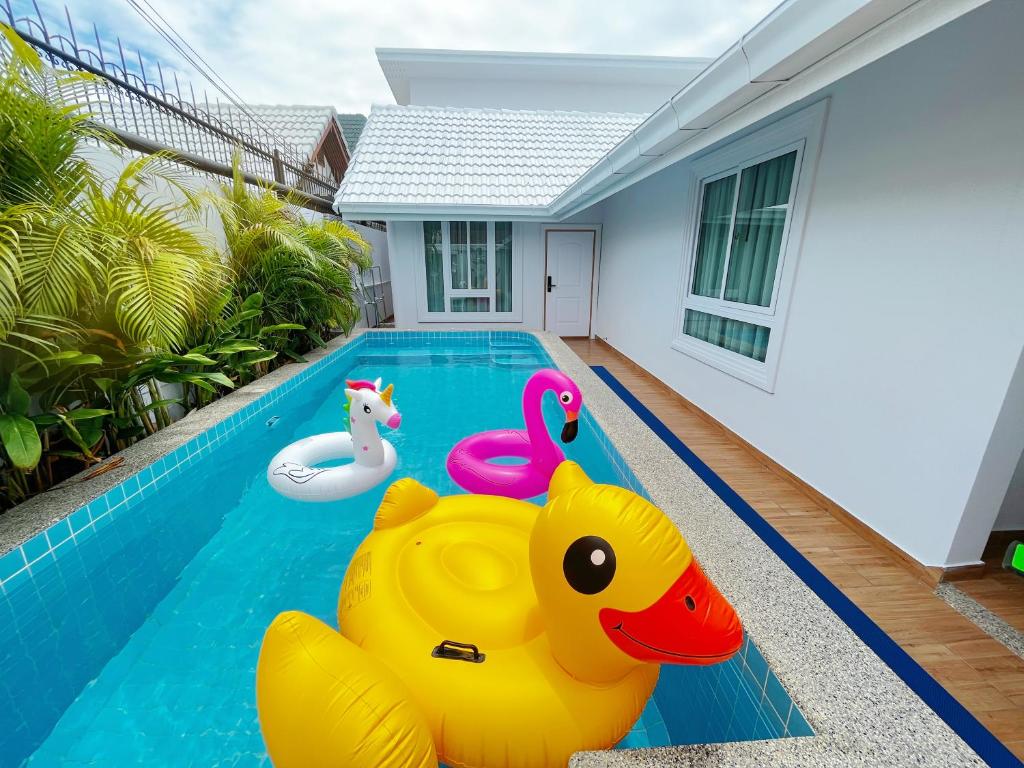 a swimming pool with a rubber duck inflatable pool toy at Pattaya Aqua Villa - Pool - Kitchen - BBQ - Smart TV in Pattaya South