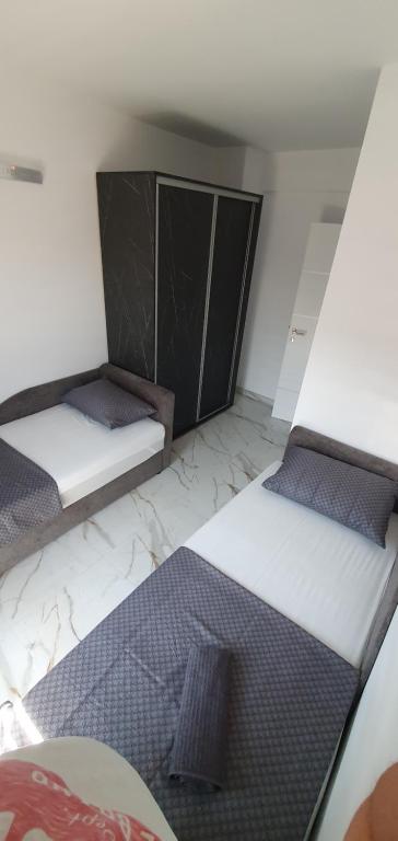 Postel nebo postele na pokoji v ubytování ITACA apartman Krupanj