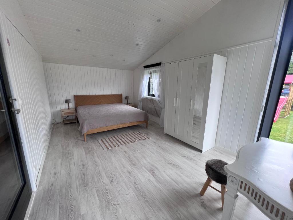 Postel nebo postele na pokoji v ubytování Spacieux chalet à Aywaille