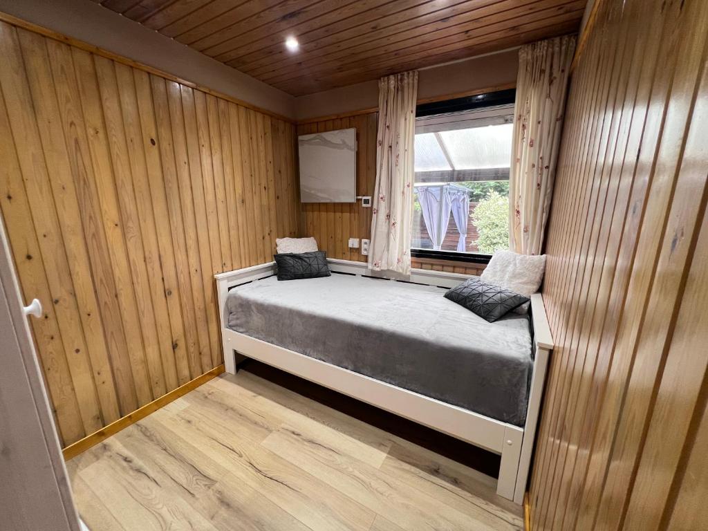 Postel nebo postele na pokoji v ubytování Spacieux chalet à Aywaille
