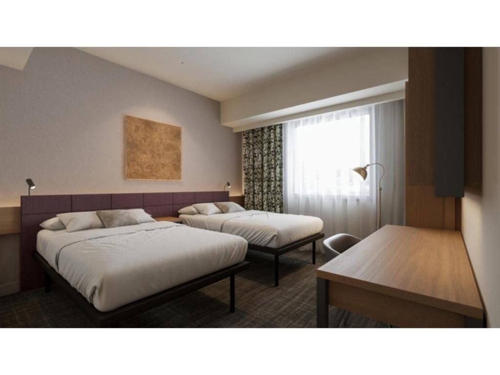 a hotel room with two beds and a window at GRIDS Premium Hotel Otaru - Vacation STAY 68543v in Otaru