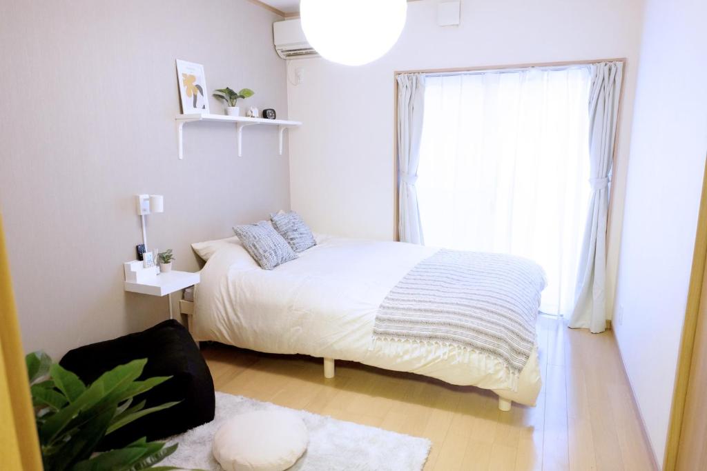 Tempat tidur dalam kamar di Daiichi Mitsumi Corporation - Vacation STAY 15350