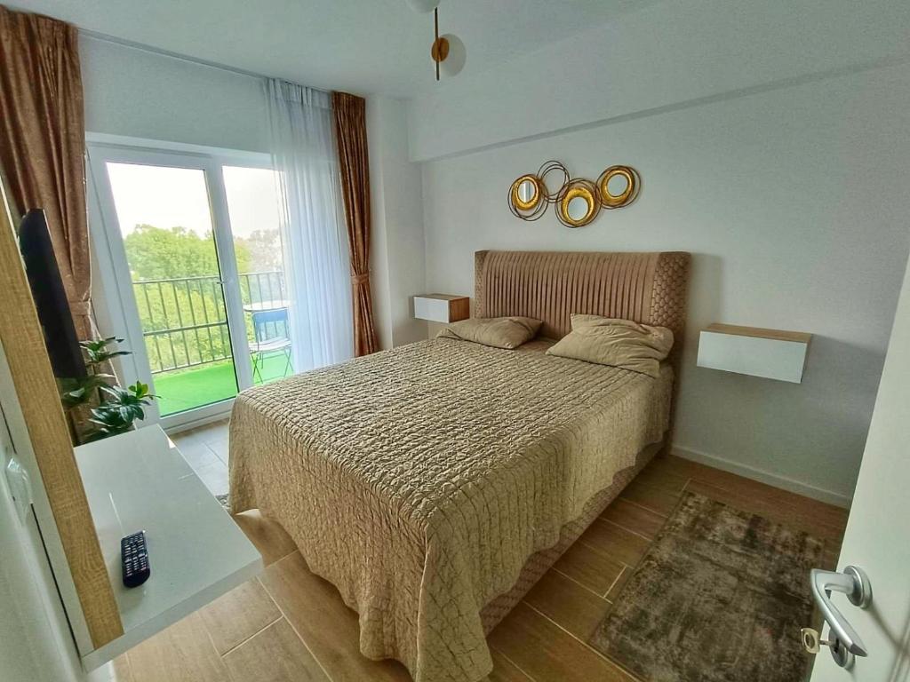 Letto o letti in una camera di First Class Apartament close to Airport and City