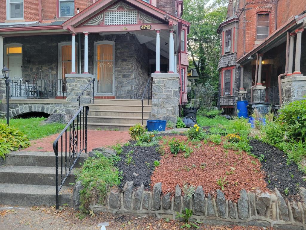 a house with a garden in front of it at A Victorian home in Philadelphia