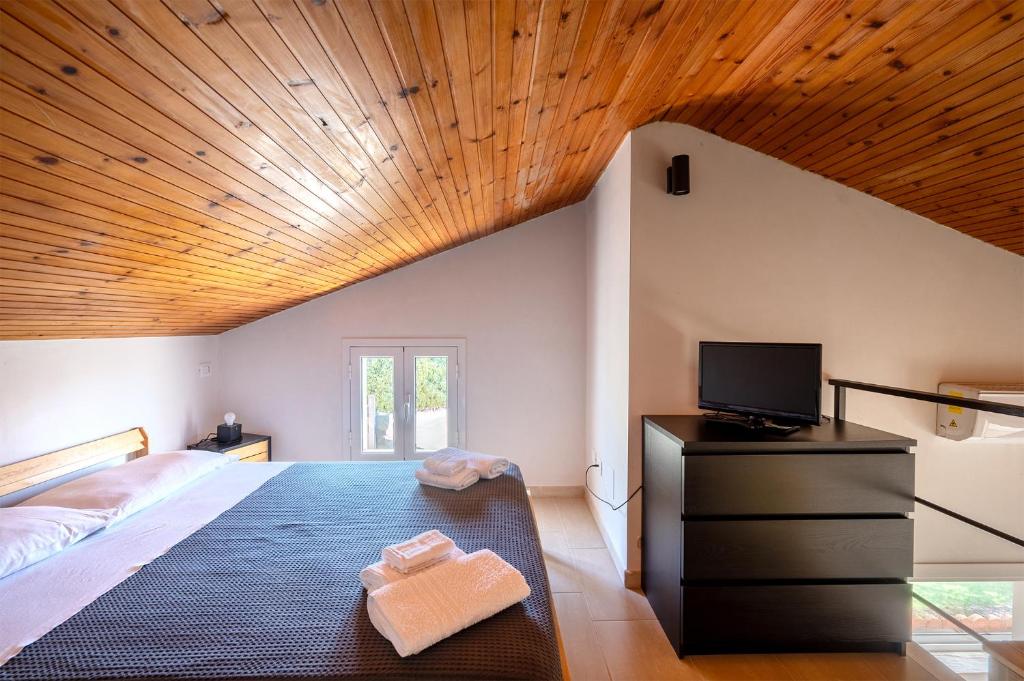Postel nebo postele na pokoji v ubytování La Caletta di Afrodite