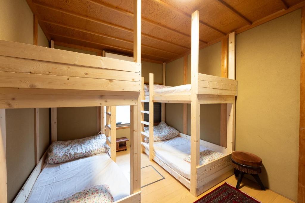 a room with two bunk beds in a house at Setouchi base - Vacation STAY 48109v in Mitoyo