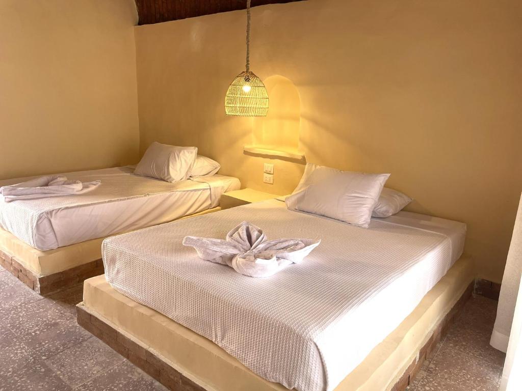 Postel nebo postele na pokoji v ubytování Ayujidda Nubian House
