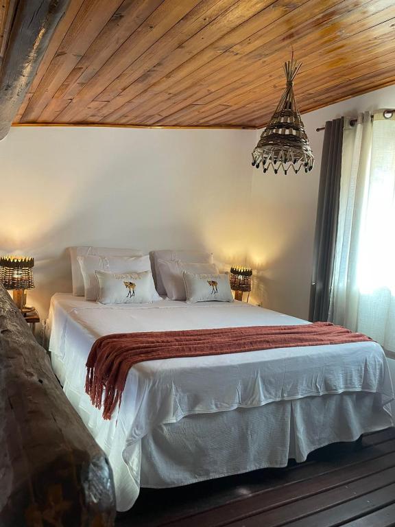 Postel nebo postele na pokoji v ubytování Lobo Guará Hospedagem - Loft Privativo