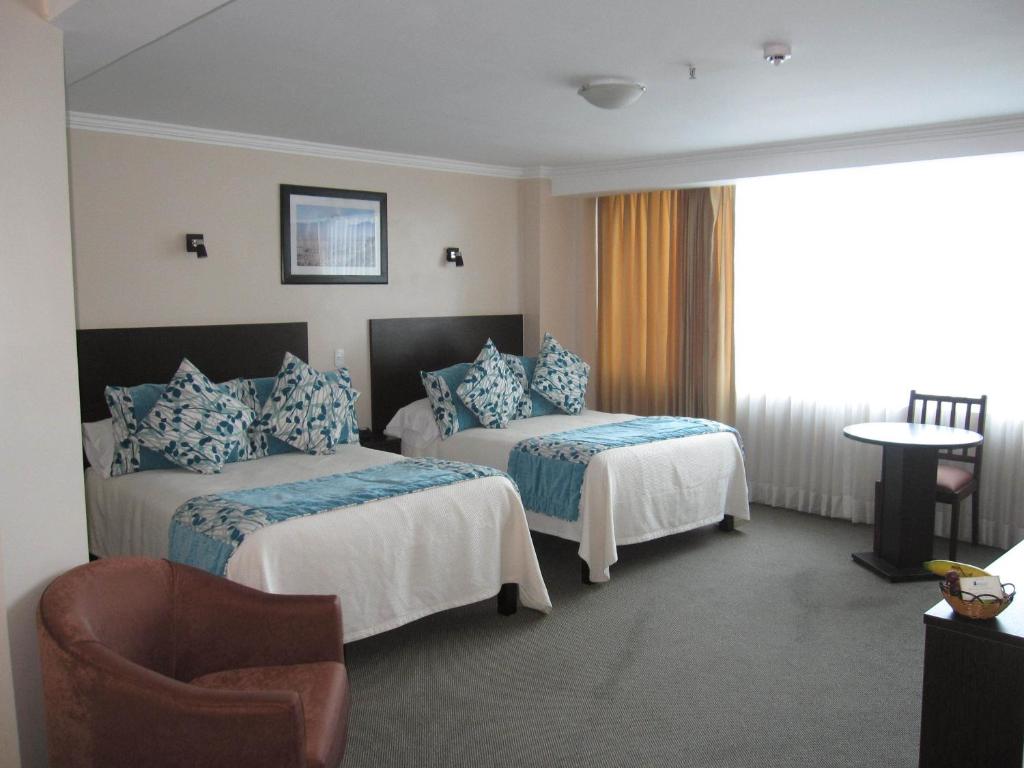 Postel nebo postele na pokoji v ubytování Hotel Novalux