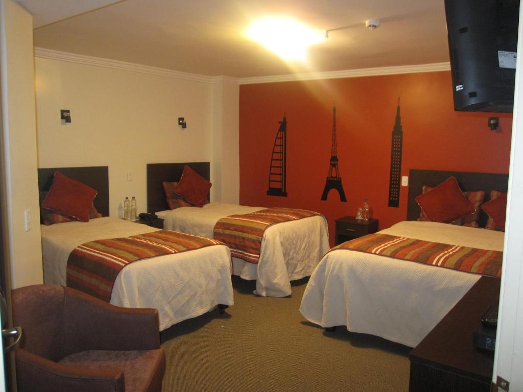 Postel nebo postele na pokoji v ubytování Hotel Novalux