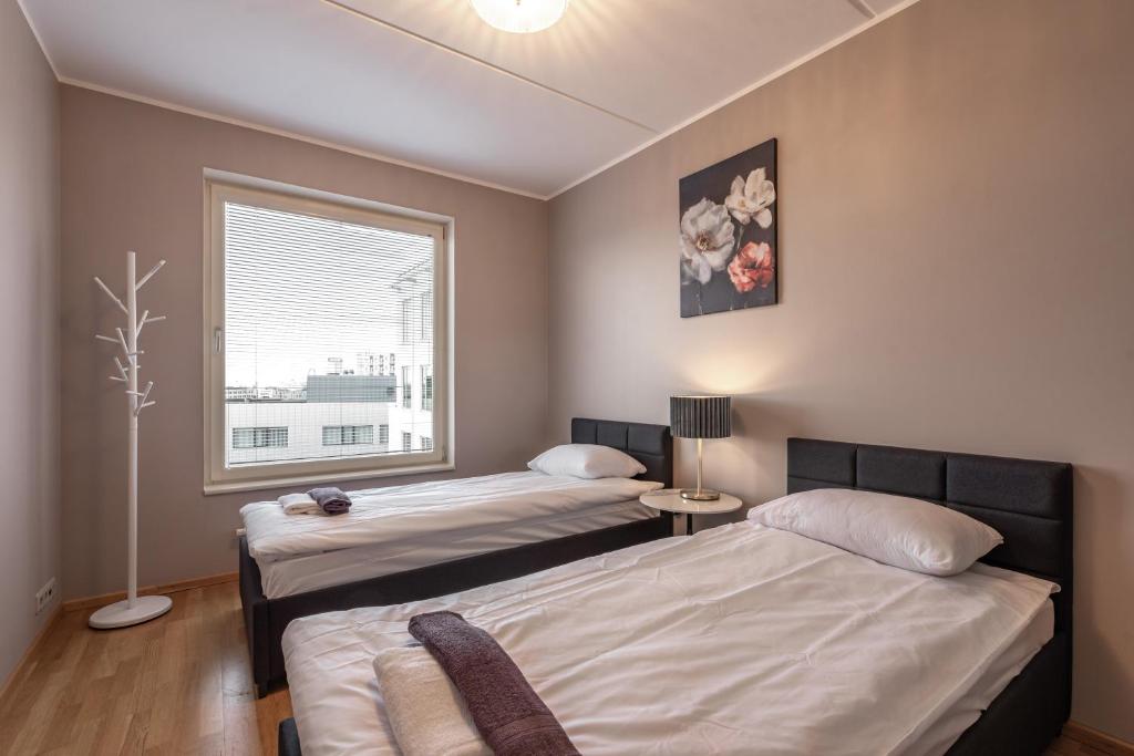 Postel nebo postele na pokoji v ubytování AirHome - Heart of City Center