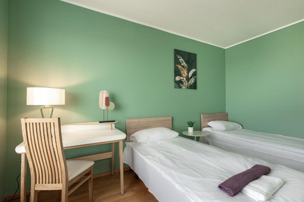 Postel nebo postele na pokoji v ubytování AirHome - Heart of City Center