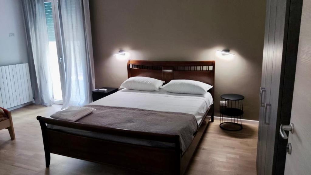 Postel nebo postele na pokoji v ubytování Dimora Rudiae Lecce