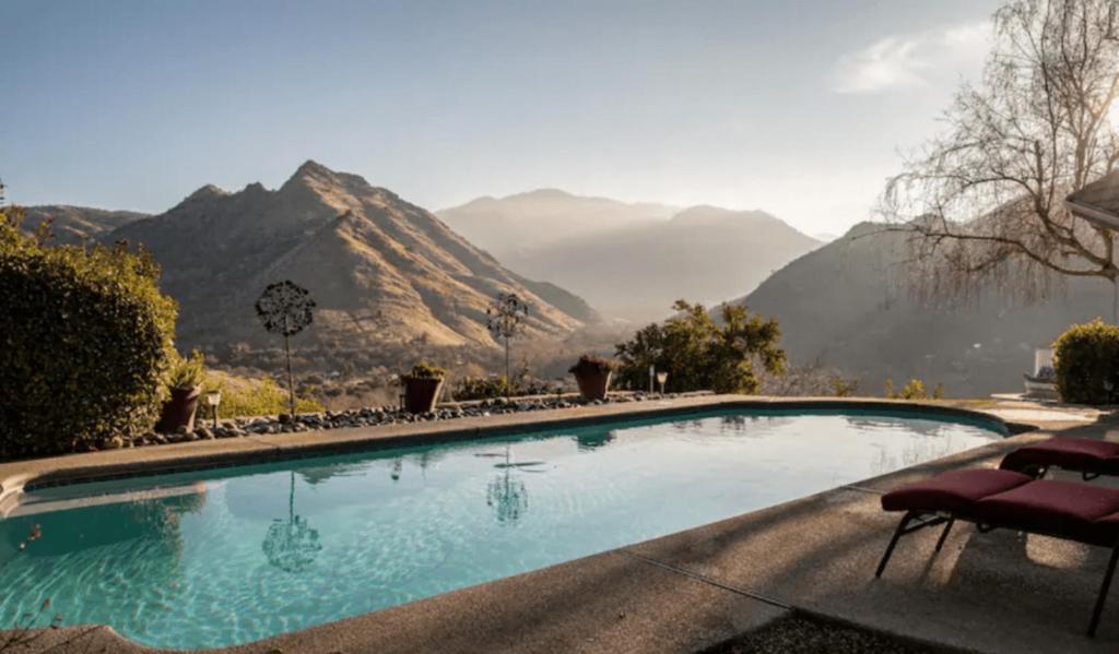 a swimming pool with a mountain in the background at Your 5 STAR Paradise Getaway "Sequoia Alta Vista" in Three Rivers