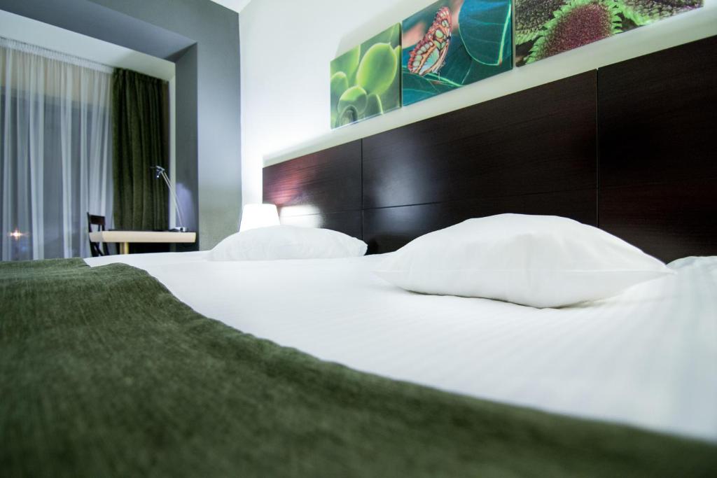 Postel nebo postele na pokoji v ubytování Hotel Orizont