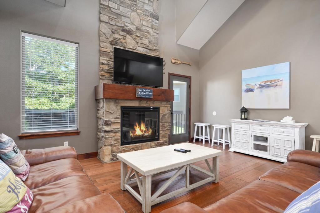 a living room with a couch and a fireplace at TOP Rated! Family Home with 6 King, 1 Queen & Hot tub in Hollister