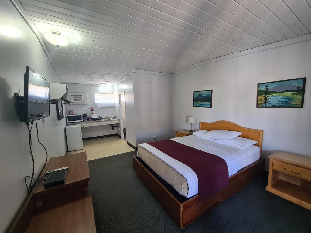 Postel nebo postele na pokoji v ubytování Sundowner Motel