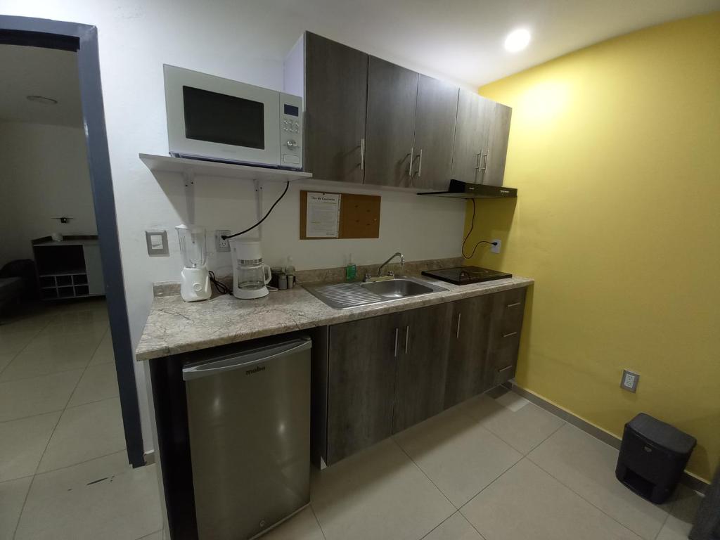 Kuchyň nebo kuchyňský kout v ubytování Tu Estancia Guadalajara