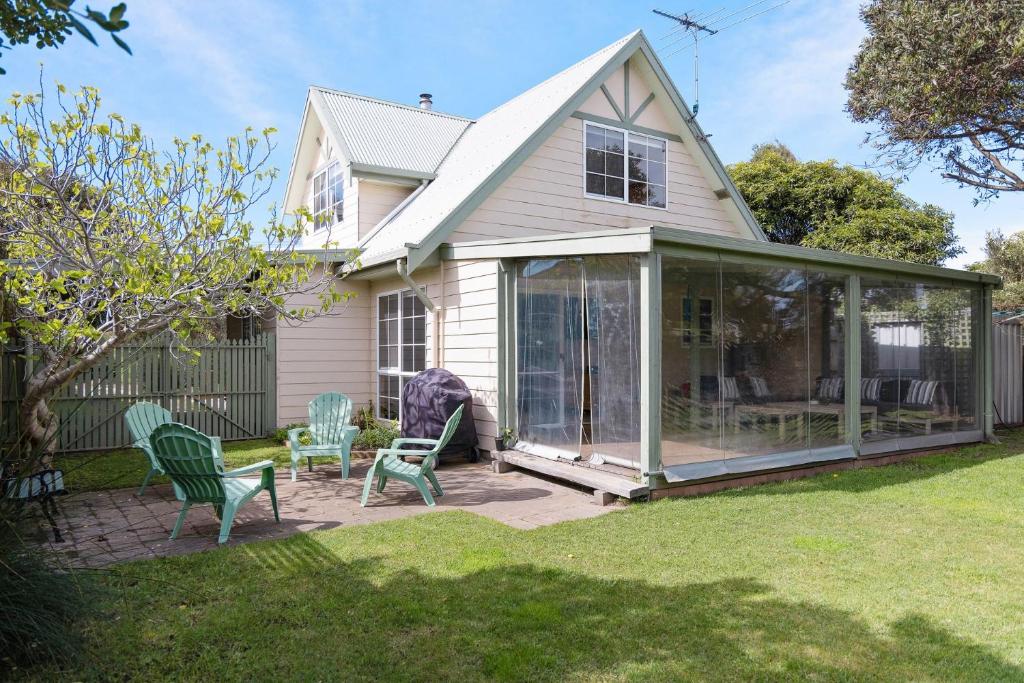 a screened in porch of a house at Cape Cottage in Cape Woolamai