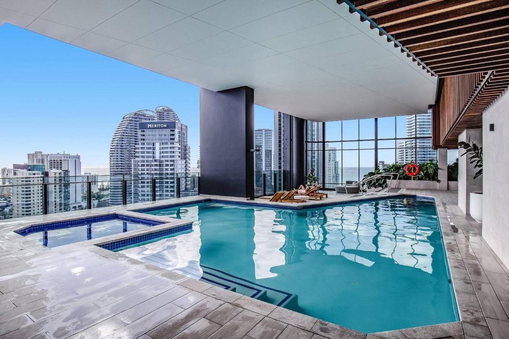 a swimming pool on the roof of a building at Golden Horizons - Resort Living in the Clouds in Gold Coast