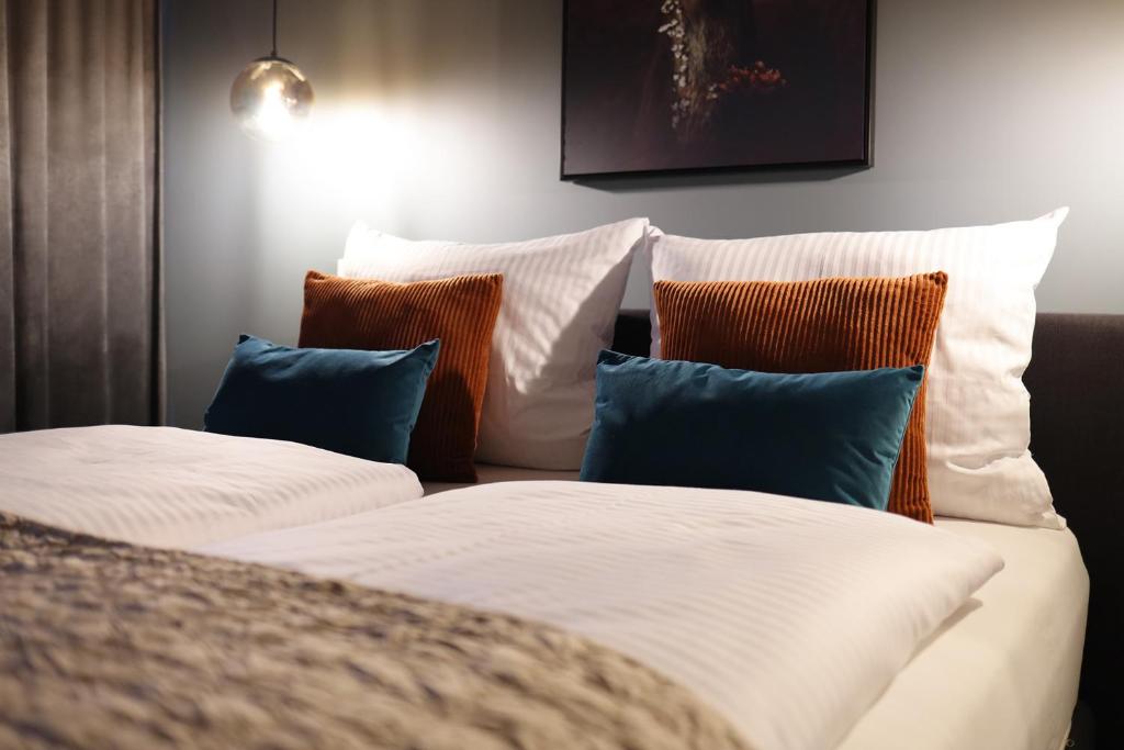 En eller flere senge i et værelse på MERCADO