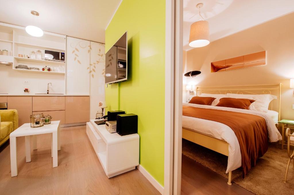 Posteľ alebo postele v izbe v ubytovaní Suites One