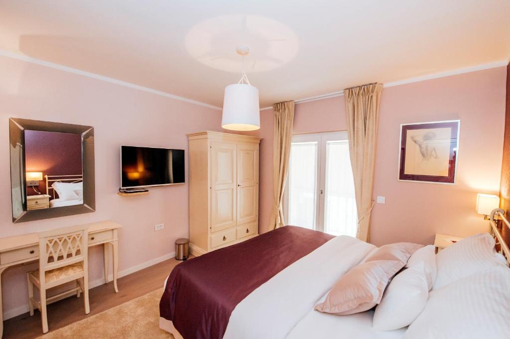Posteľ alebo postele v izbe v ubytovaní Suites One