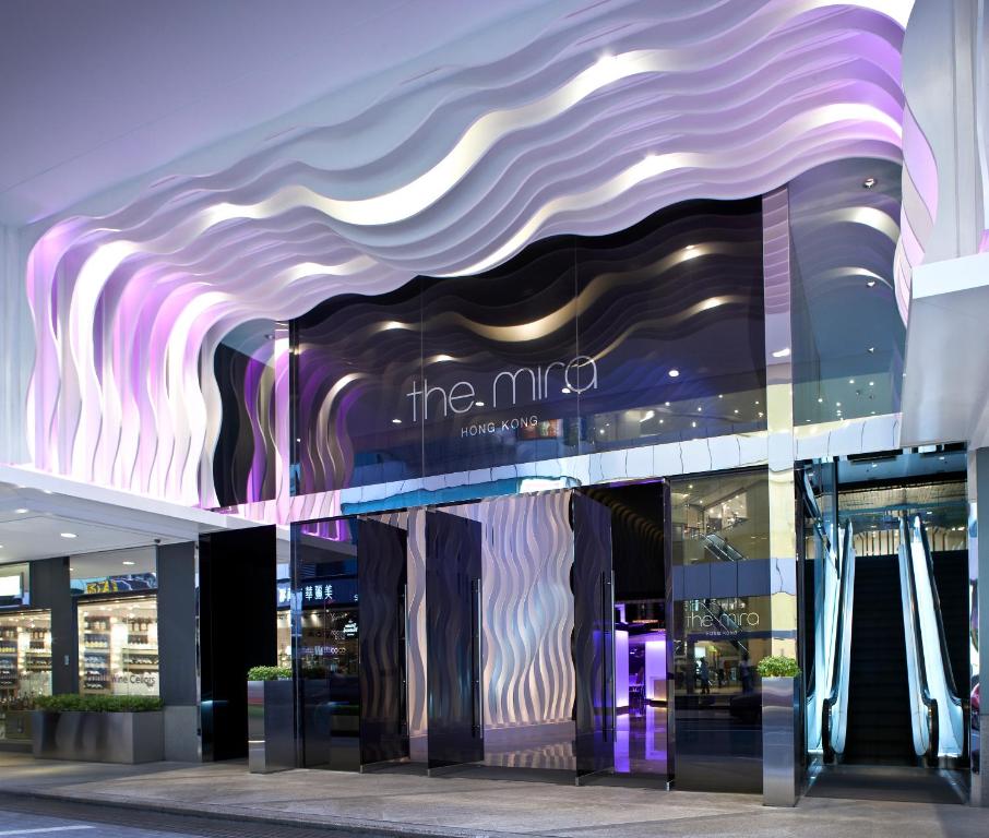 a store front of a building with a purple and white facade at The Mira Hong Kong in Hong Kong