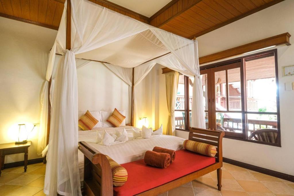 Postel nebo postele na pokoji v ubytování Bhundhari Chaweng Beach Resort Koh Samui - SHA Plus