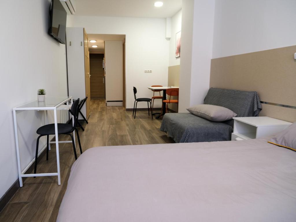 TV a/nebo společenská místnost v ubytování Alianza Suites