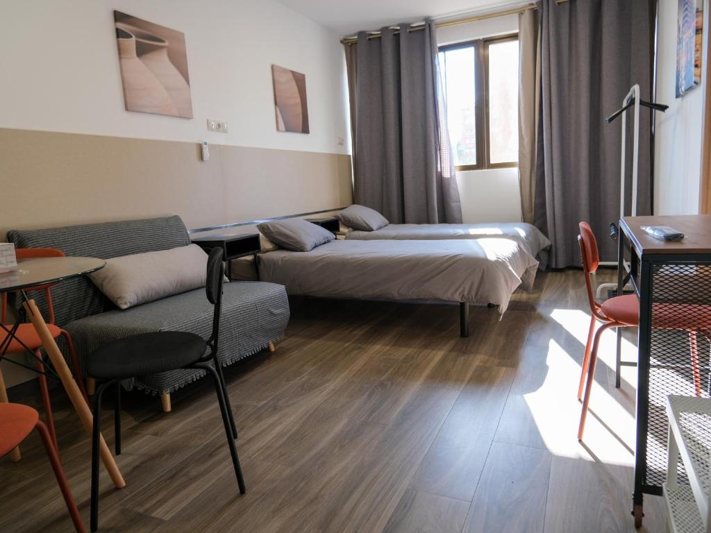 Postel nebo postele na pokoji v ubytování Alianza Suites
