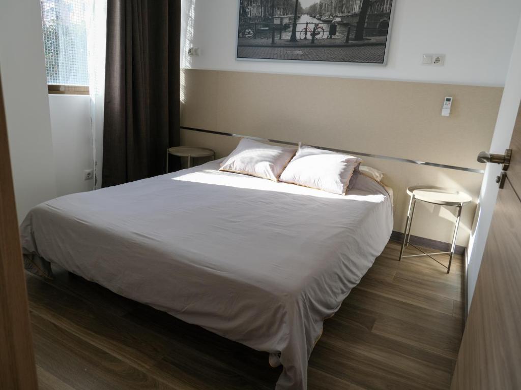 Postel nebo postele na pokoji v ubytování Alianza Suites