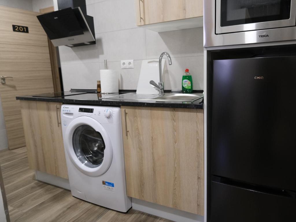 Kuchyň nebo kuchyňský kout v ubytování Alianza Suites
