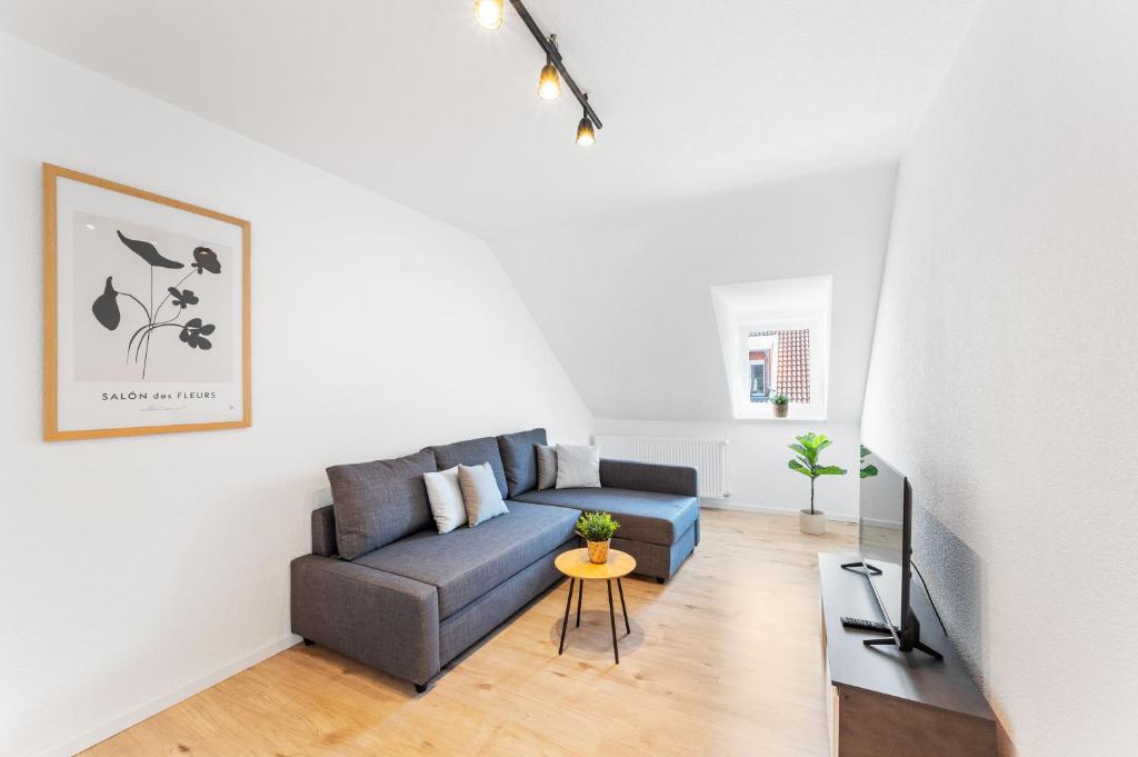 a living room with a couch and a table at Casa Bergstraße 3 in Bensheim