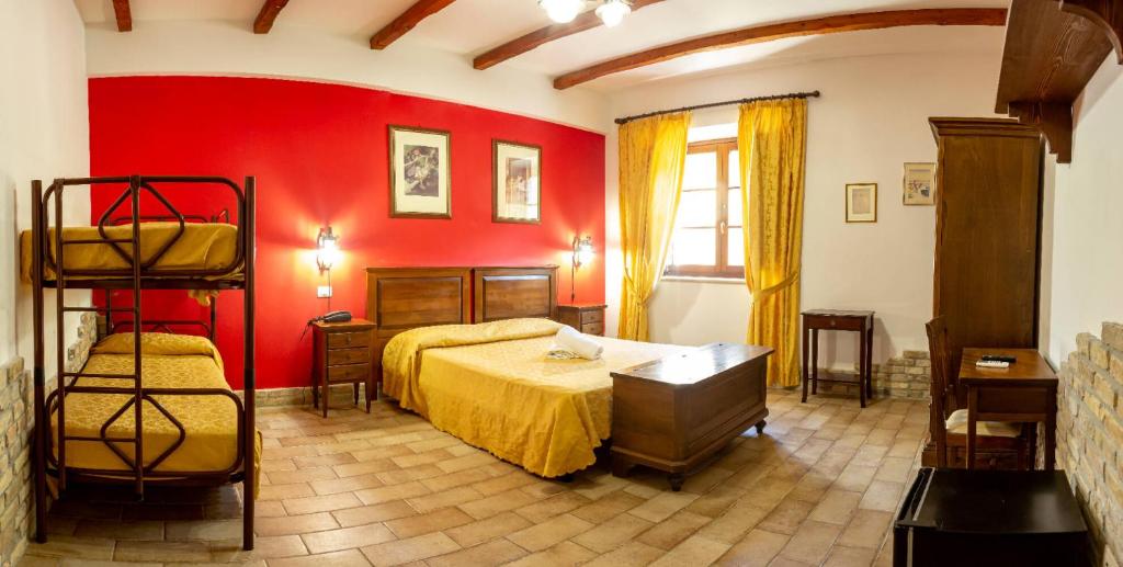 Postel nebo postele na pokoji v ubytování Country House Il Cascinale